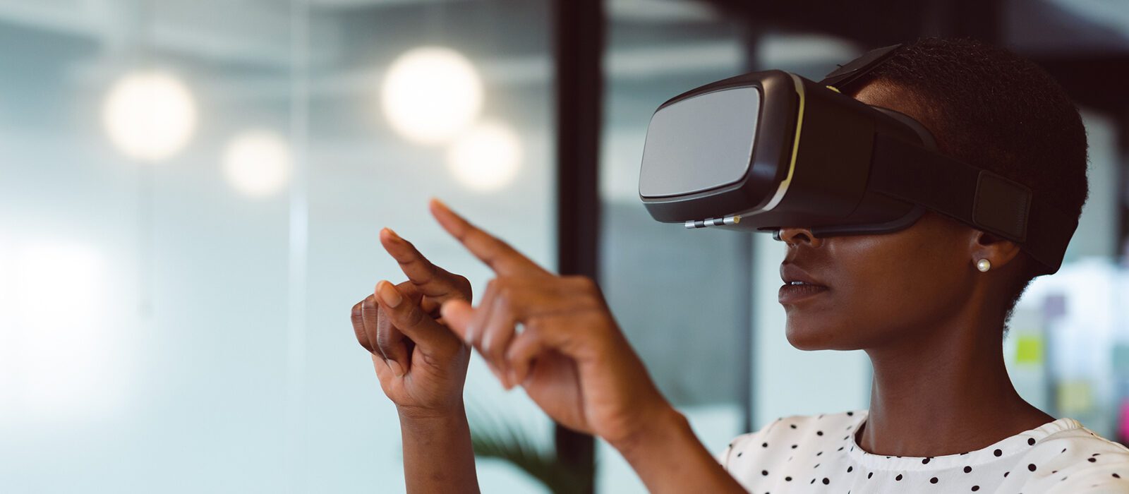 Person using VR headset at work.