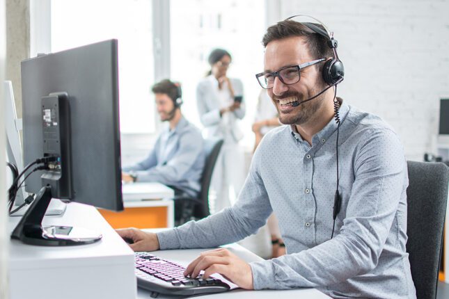 Person wearing headset working in the office.