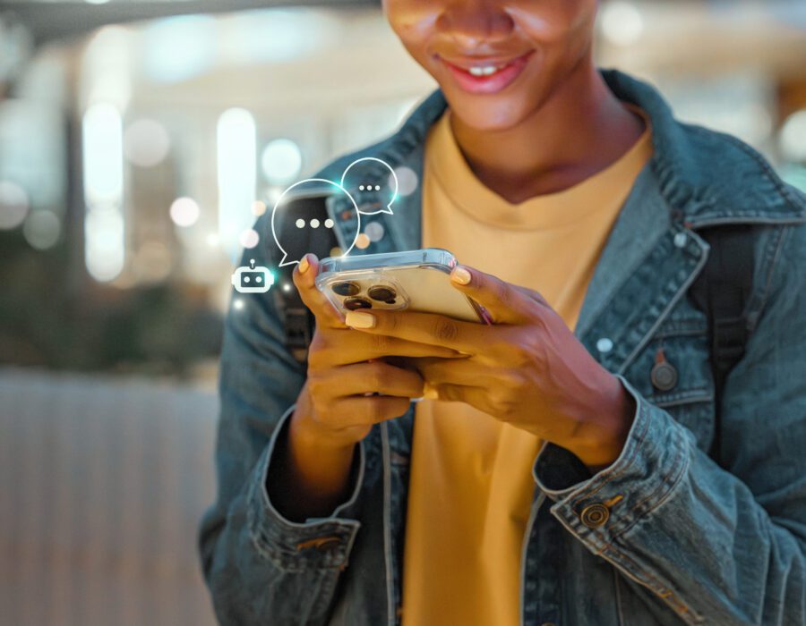 Smiling woman using an AI chatbot. Futuristic icons float around and above her phone.